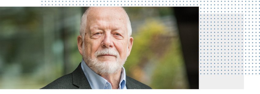 Prof. emer. Dr. Dr. h.c. mult. Fritz W. Scharpf A portrait of an older man with a beard, wearing a blazer and a light blue shirt, set against a blurred outdoor background.